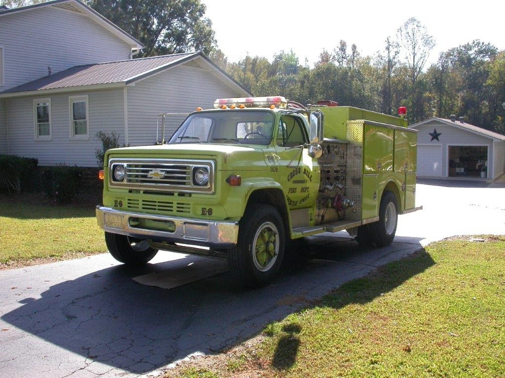 Yellow fire truck in driveway